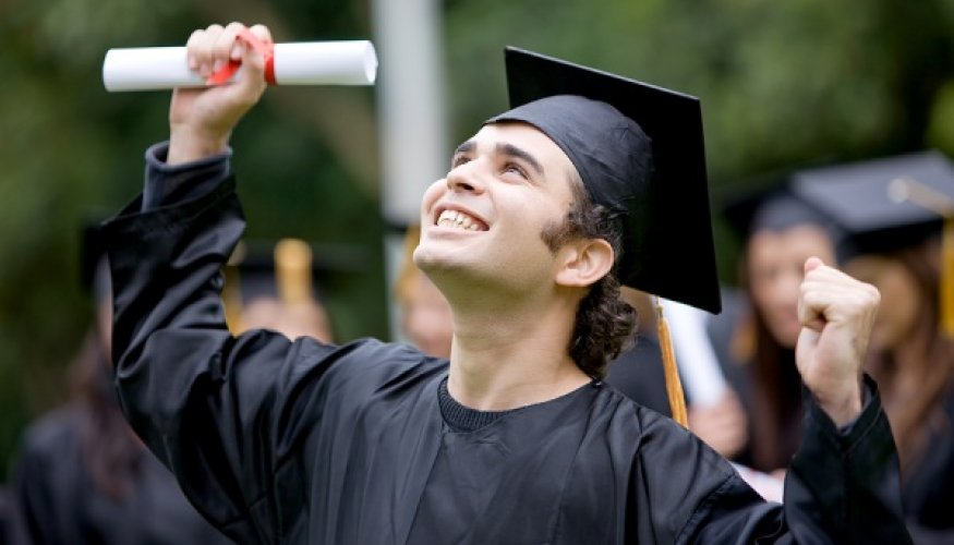 College graduate celebrating with diploma