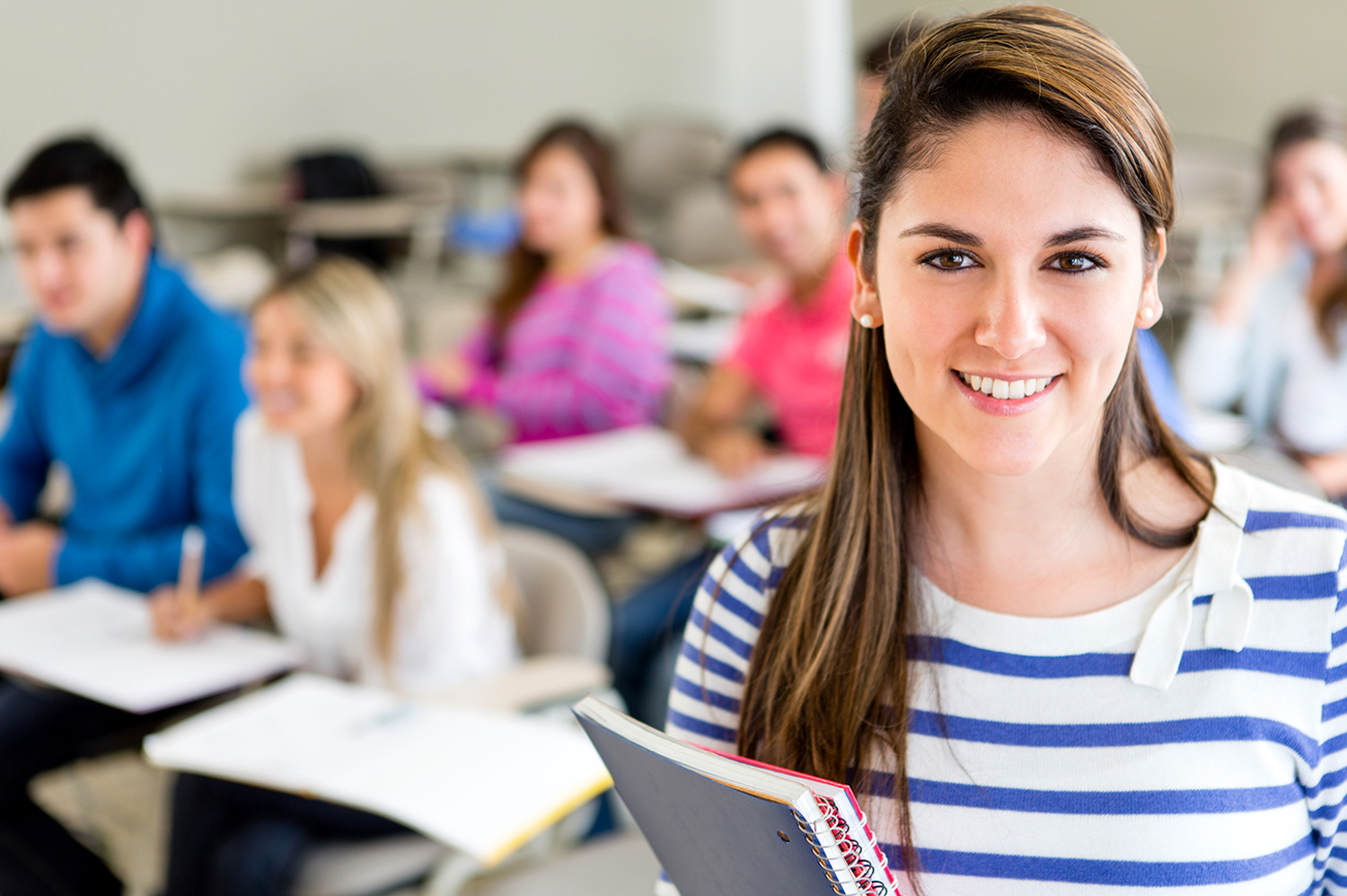 College student in a classroom with classmates